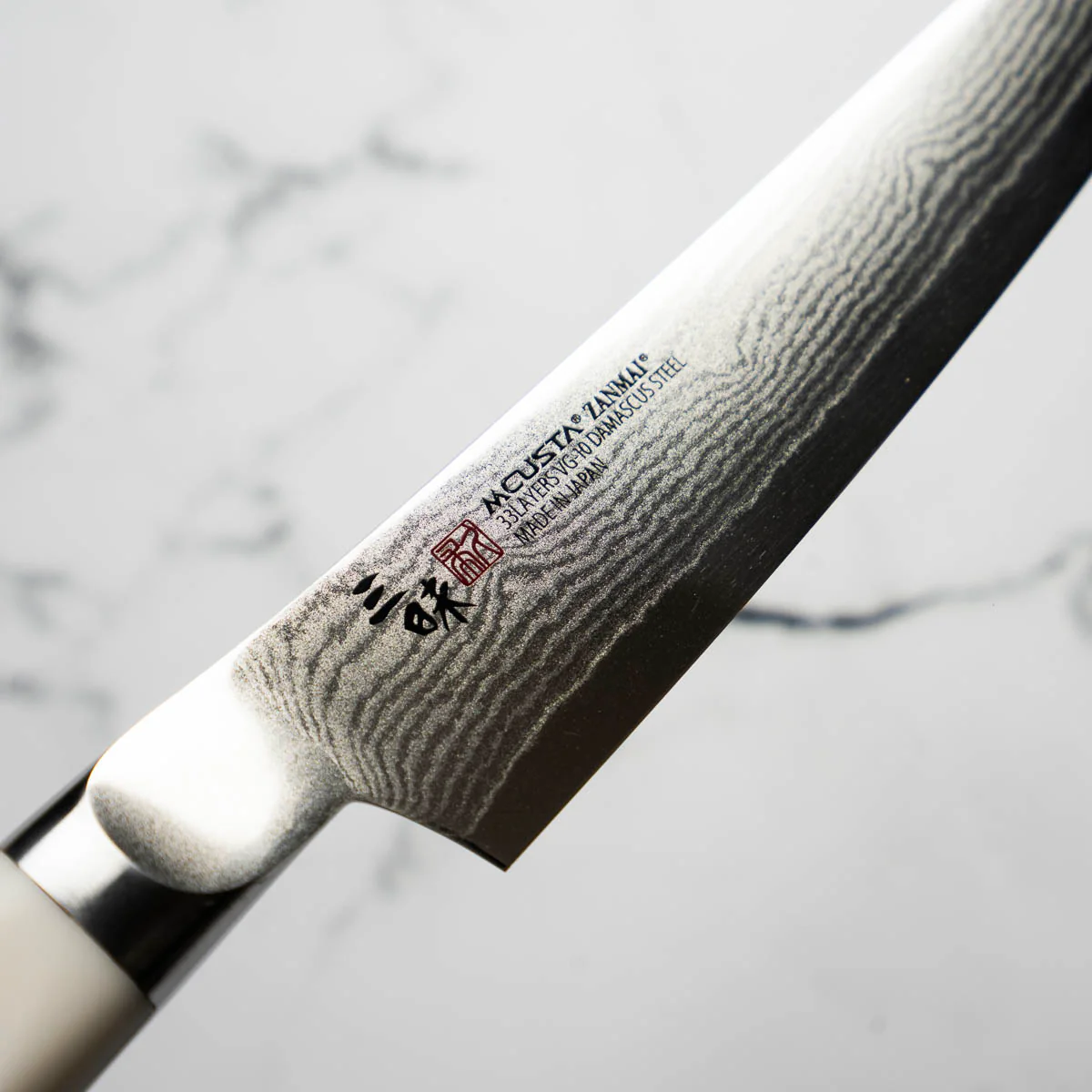 Mcusta Zanmai Corian Classic VG10 Damascus Petty 150mm - Image 6