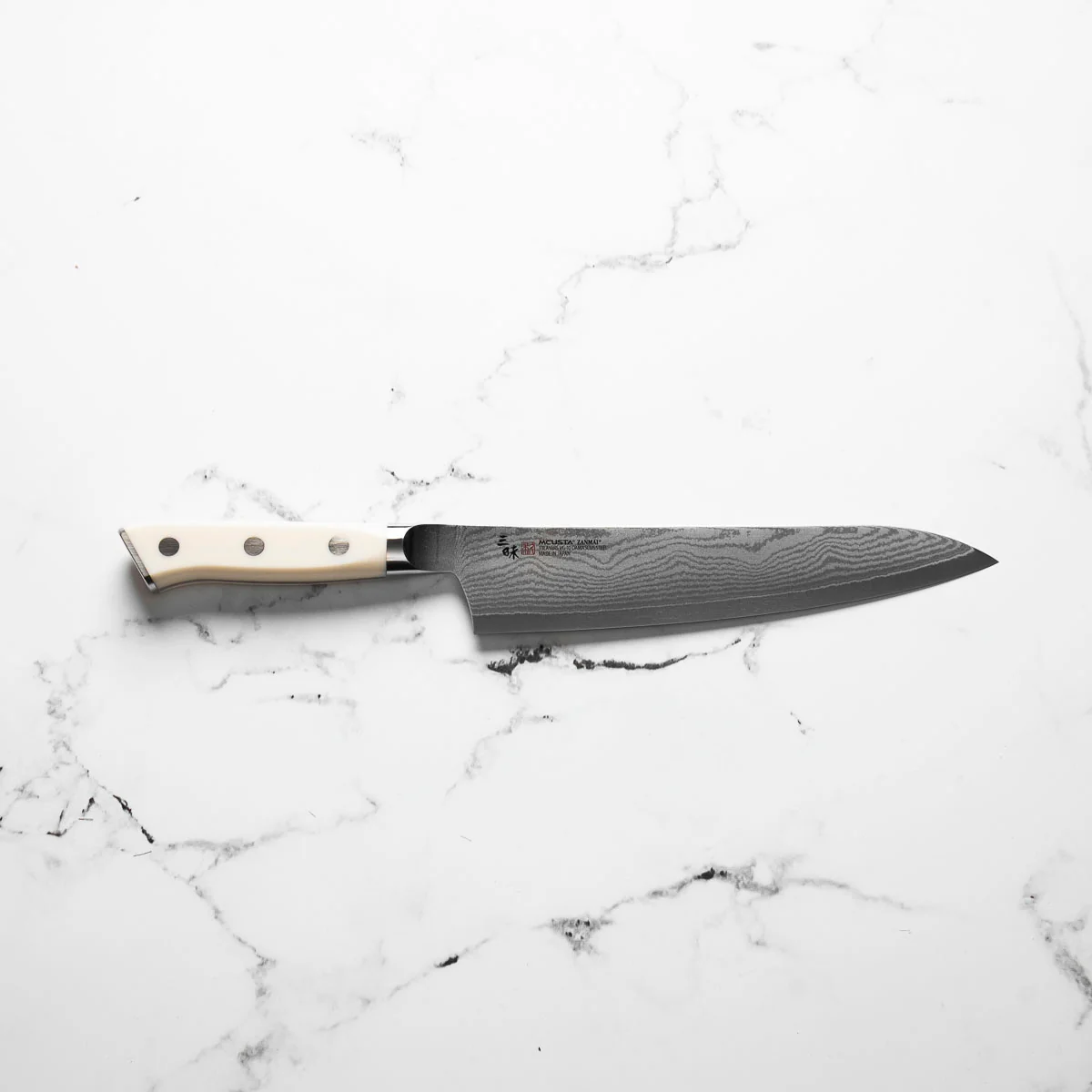 Mcusta Zanmai Corian Classic VG10 Damascus Gyuto 210mm - Image 4